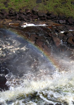 Rainbow, river and rocks
